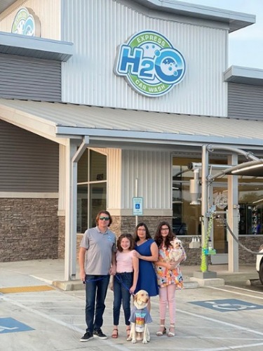 Chris Dangerfield and family in front of H2O