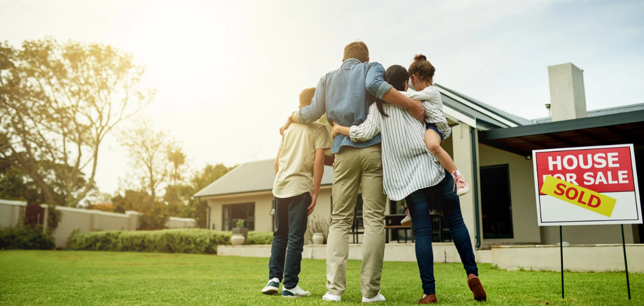 A family stands in front of their newly purchased house, having selected the mortgage option that best suits them and their future.