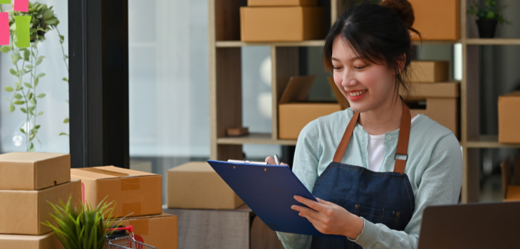 A local business owner smiles as she manages her finances with ease.