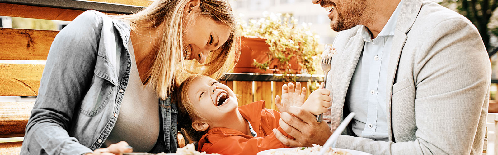 Parents and child dining.