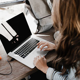 Woman using laptop.