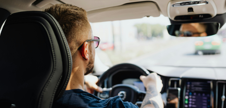 A man confidently drive through Houston knowing his investment is protected.