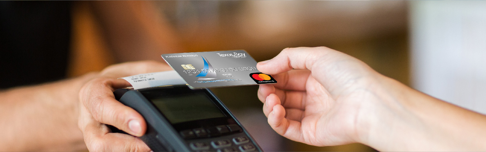 person paying with credit card