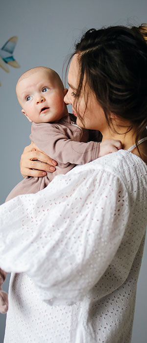 Mom and baby in nursery.